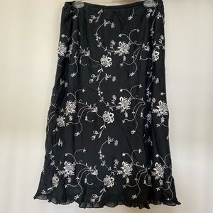 black skirt with white flower embroidery
